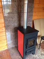 Купить стальной камин Везувий ПК-01 (270) в Бобруйске фото в интерьере в Бобруйске