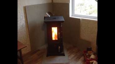 Отопительная печь Термофор Статика Тетра, чёрная бронза фото в интерьере в Бобруйске