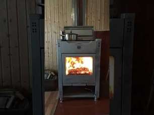 Стальной камин со стеклом Теплодар Кадриль фото в интерьере в Бобруйске