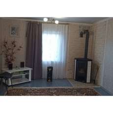 Стальной камин с шамотом Мета-Бел Ритм L фото в интерьере в Бобруйске