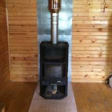 Печь-камин с шамотом Мета-Бел Ангара-Аква в интерьере фото в Бобруйске