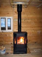 Печь-камин Бавария водяной с плитой в интерьере в Бобруйске